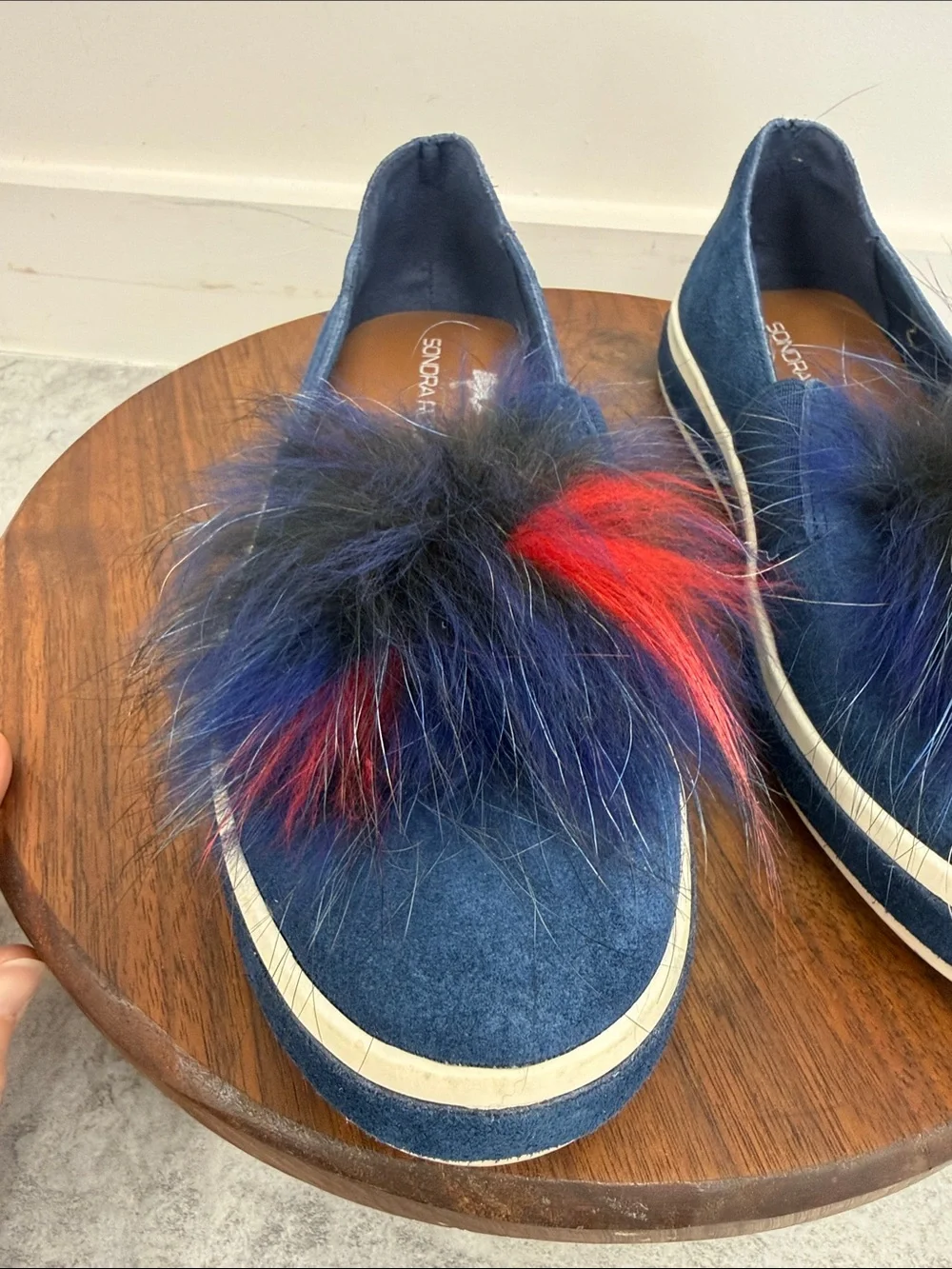 Sondra Roberts Navy Slip-On Sneakers with Red and Black Faux-Fur Poms‎